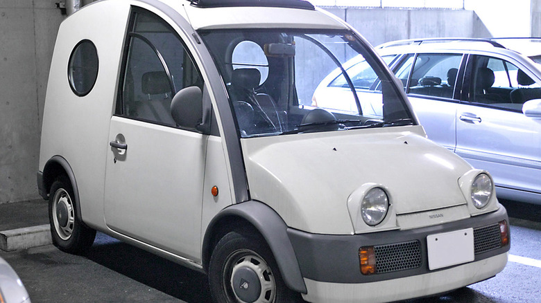 A while Nissan S-Cargo in a parking garage