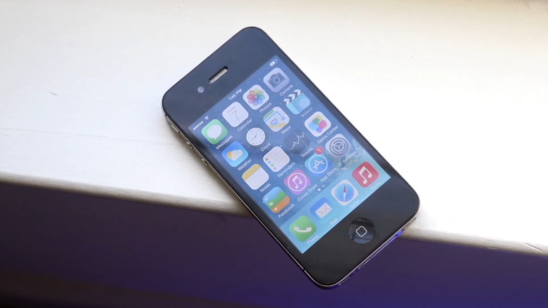 iPhone 4 sitting on a white surface