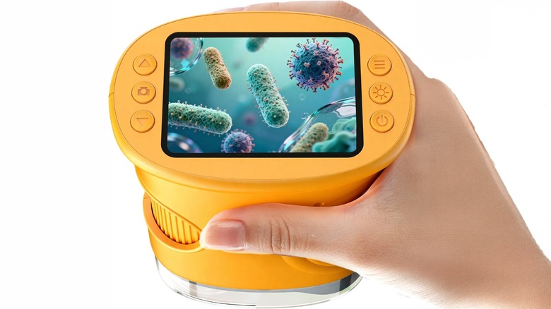 A hand holding a Handheld Digital Microscope