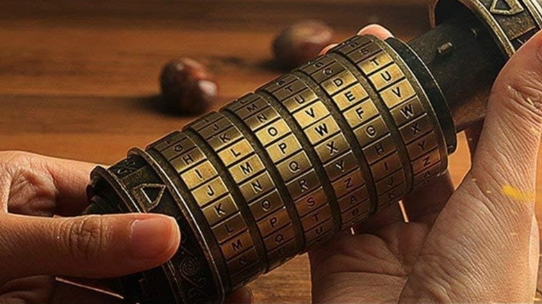 A person holding a Cryptex