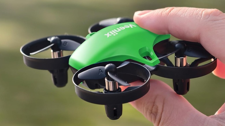 A person holding the Veeniix V995 Mini RC Drone