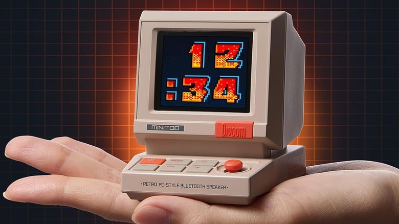 A hand holding the Retro PC-Style Computer Speaker