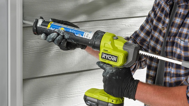 caulking door frame with Ryobi caulk gun