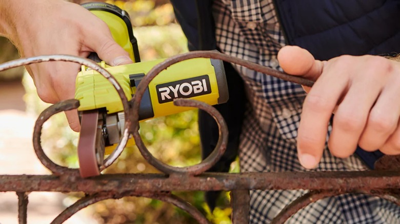 performing detailed sanding on a gate