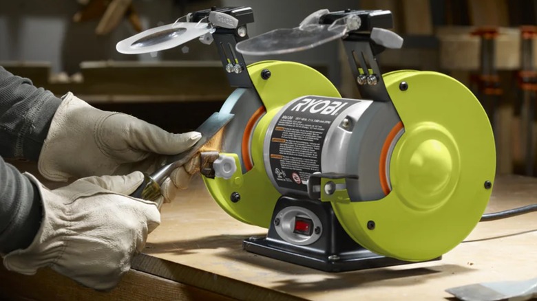 sharpening chisel on bench grinder
