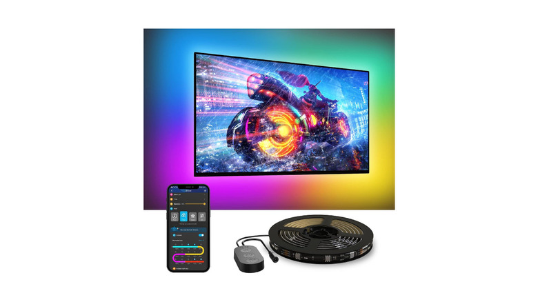 A Govee TV RGB LED backlight with remote, providing a rainbow backlight to a wall-mounted TV.