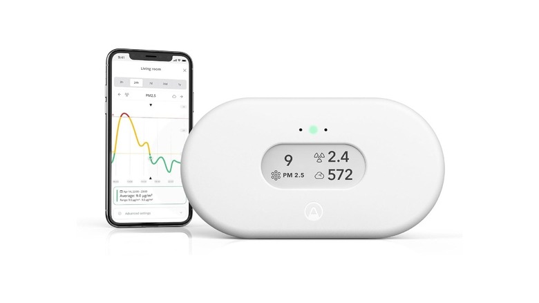 Airthings View Plus with a smartphone next to it