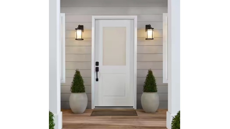 Feather River smart glass door with lamps next to it