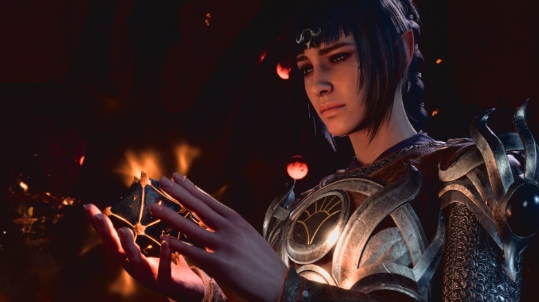 Screenshot from "Baldur's Gate 3" showing a character holding a glowing magical object