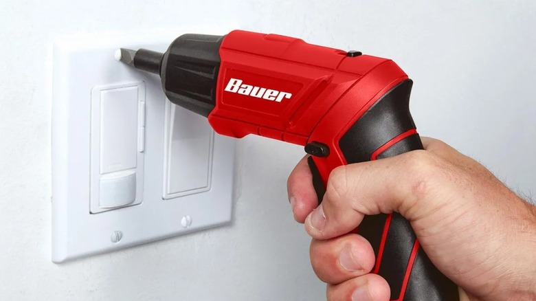 installing light switch plate with Bauer screwdriver
