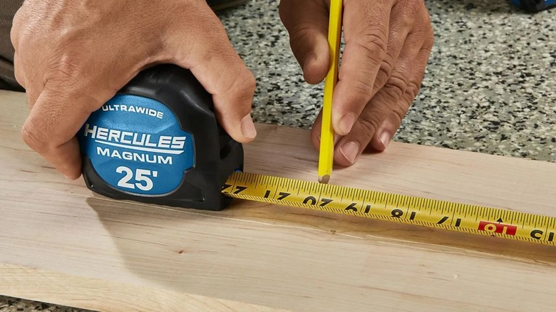 measuring board with Hercules tape measure