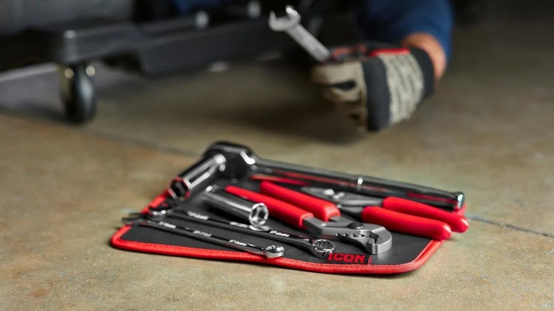 magnetic tool mat near mechanic on a creeper