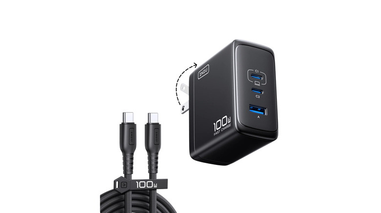 Laptop charger and cable over a white background