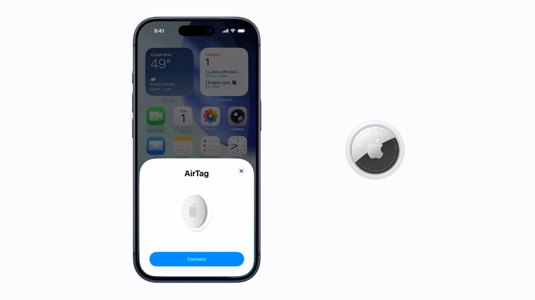 An AirTag being set up with an iPhone