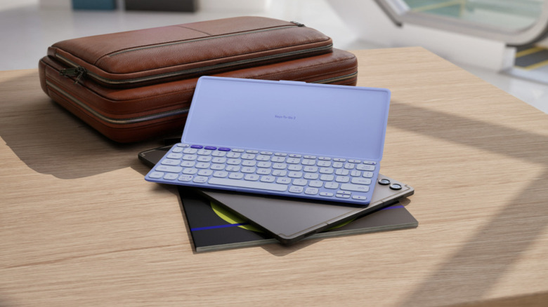 Logitech Keys-To-Go 2 resting on tablets on a table