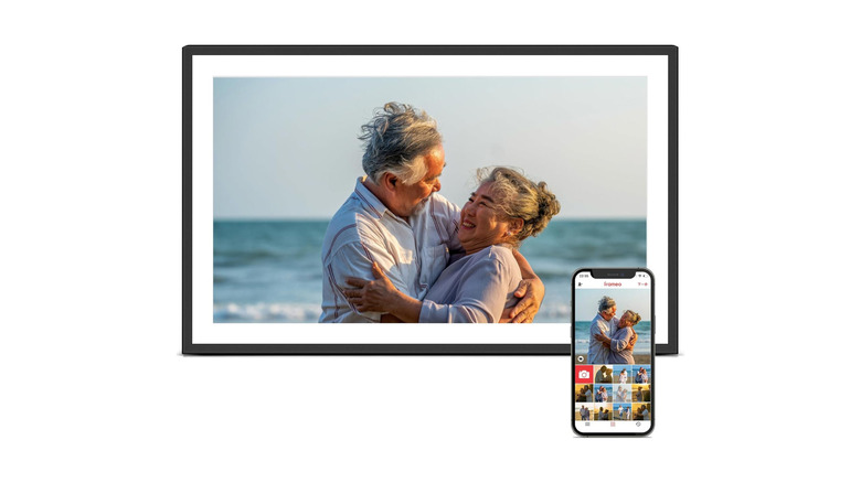 Digital picture frame with a smartphone over a white background