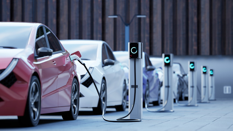 Electric vehicles charging at a station