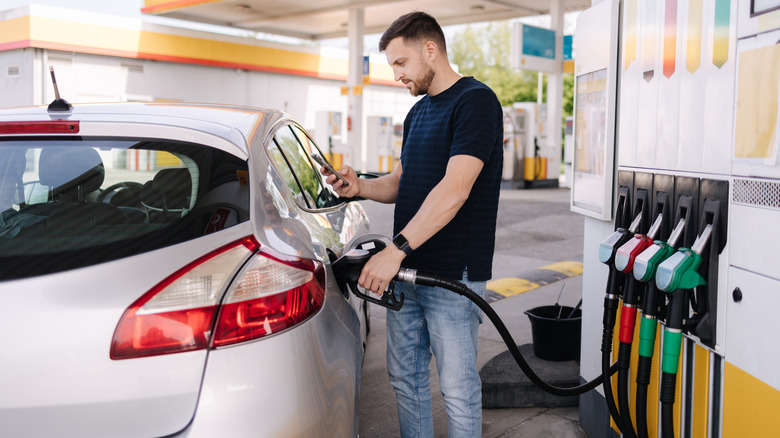 A man refueling his car