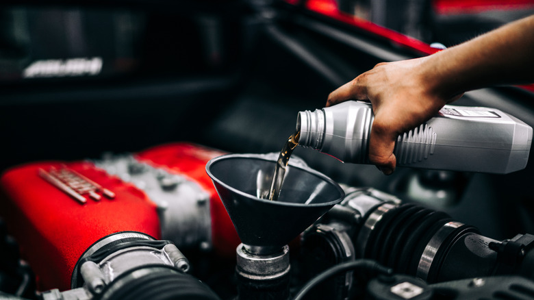 Oil being poured into an engine