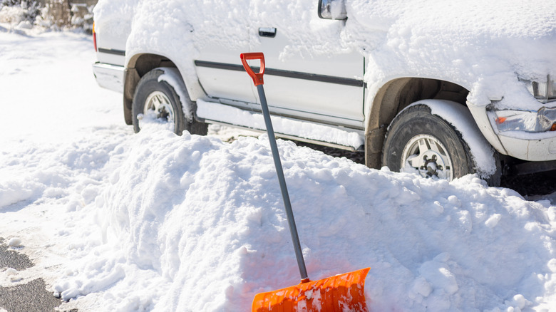 A truck packed in by snow