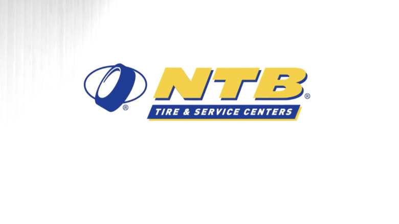 The iconic white and yellow logo of NTB Tire on a white background, which stands for National Tire and Battery.