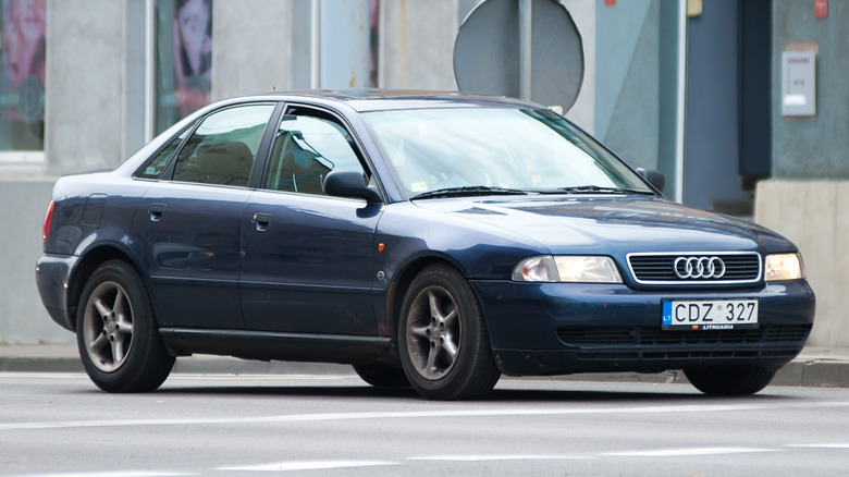 90s Audi S4 driving street