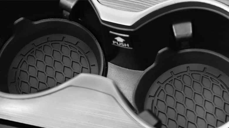 Close-up of Singaro coasters in a car's cup holders.
