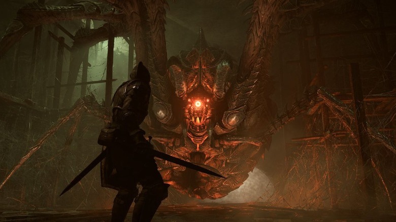 Fighting a spider-like boss in Demon's Souls