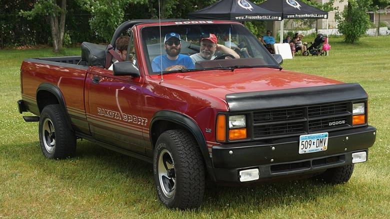 a red Dodge Dakota Sport convertible pickup