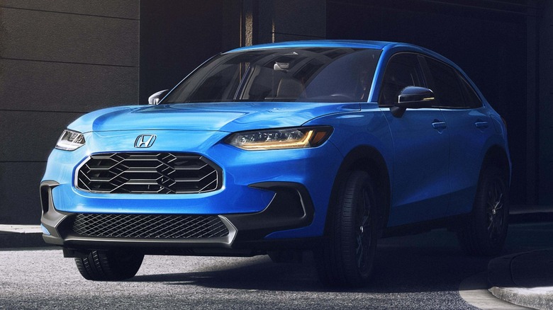 a blue 2026 Honda HR-V heading out of an alley
