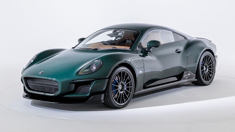 Green Caterham Project V in a studio with a white backdrop.