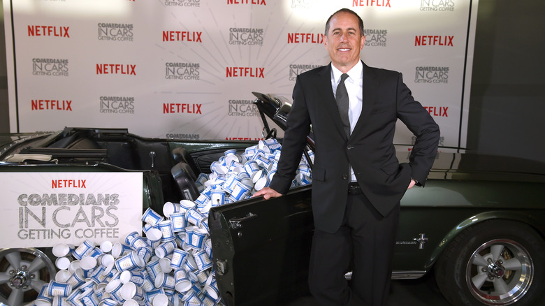 Jerry Seinfeld with a Ford Mustang