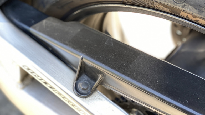 Closeup of a rear motorcycle tire with chicken strips.