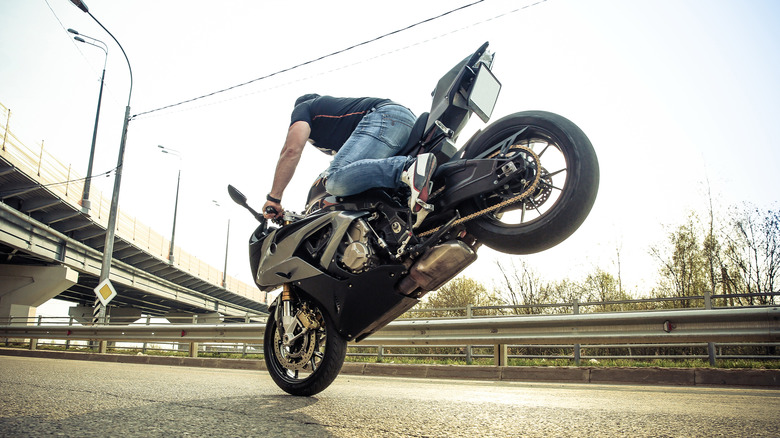 Motorcycle rider doing an endo on the front wheel.