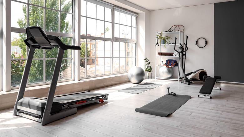 A spacious home gym with a large window