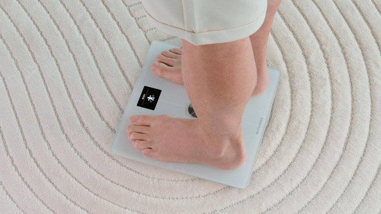 Person stepping on Withings Body Smart scales
