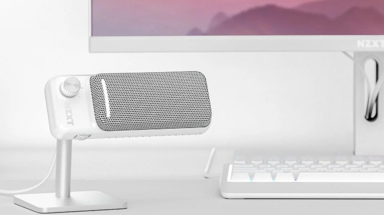 White NZXT Capsule Elite microphone in front of a white keyboard and white monitor