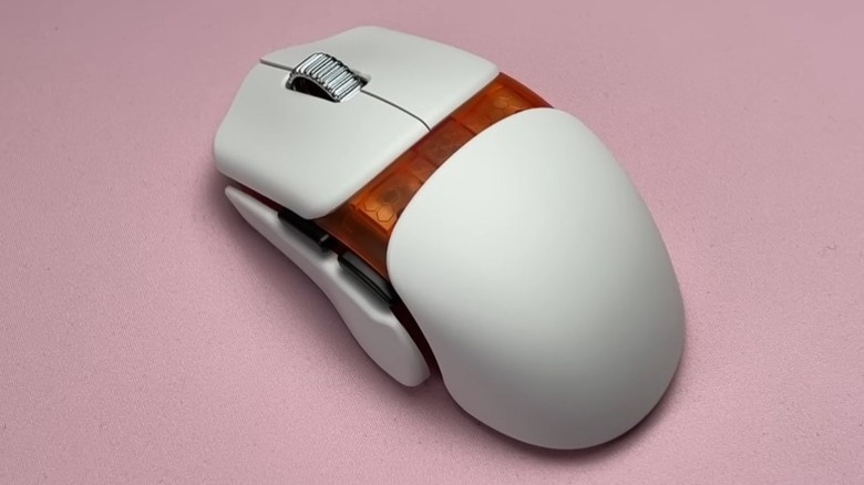 White Orbital Pathfinder mouse on a pink mousepad