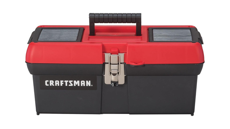 A toolbox with a red lid and a black body, labeled Craftsman