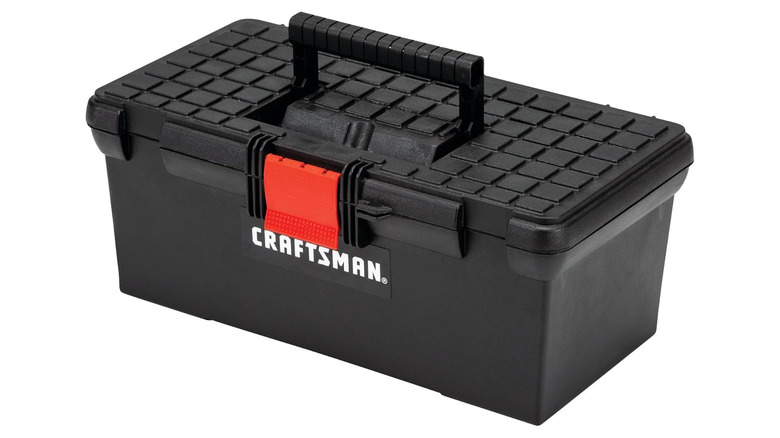 A plastic black toolbox with a handle, labeled Craftsman