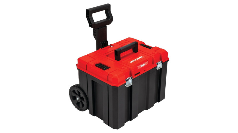 A red and black toolbox with a handle and wheels labeled Craftsman