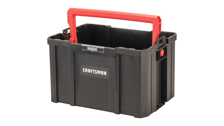 A black plastic crate with a big red handle on top, labeled Craftsman