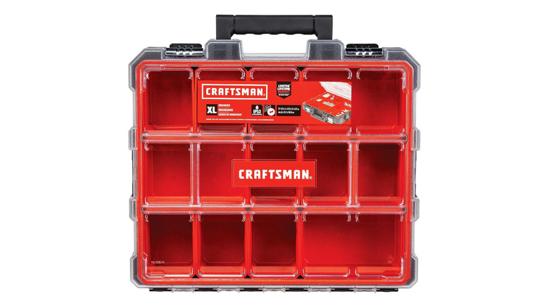 A clear lid tool box with red compartments, branded Craftsman