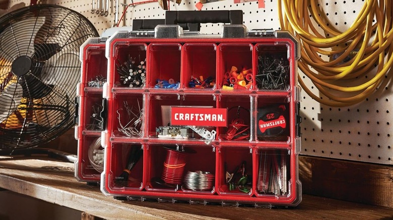A toolbox with a transparent lid and compartments labeled Craftsman