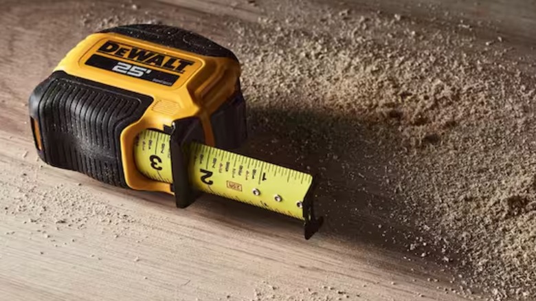 tape measure on wooden surface