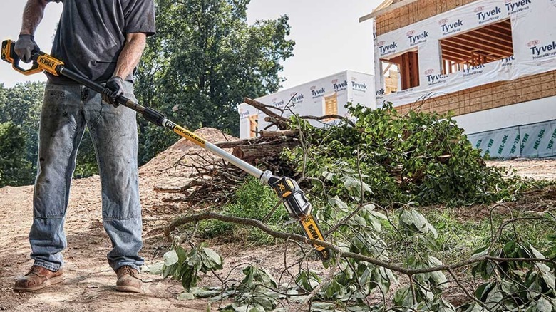 cutting branches with DeWalt pole saw