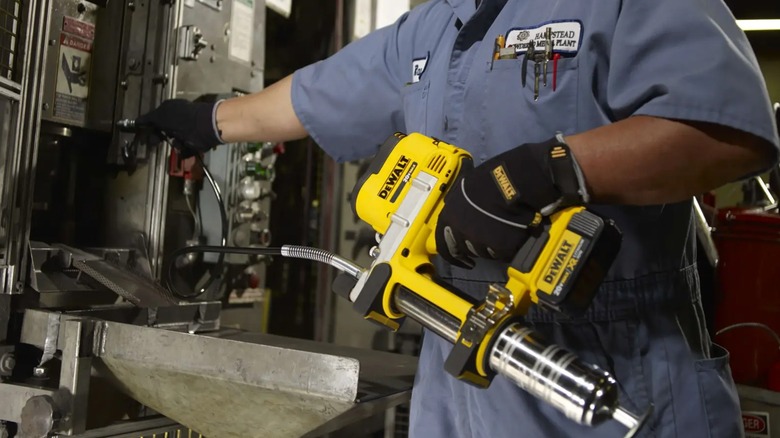 servicing machinery with DeWalt grease gun