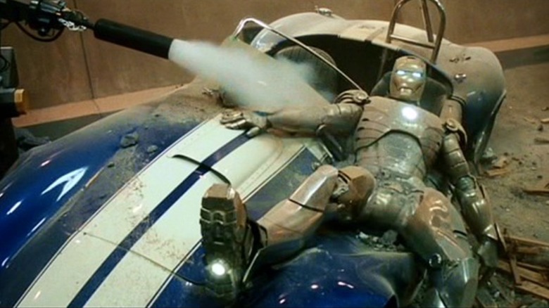 Iron Man laid out atop his 1967 AC Shelby Cobra