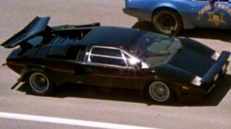 J.J. McClure driving his 1979 Lamborghini Countach LP 400S alongside a police car in "The Cannonball Run"