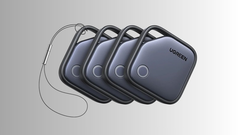 A set of four black ugreen trackers